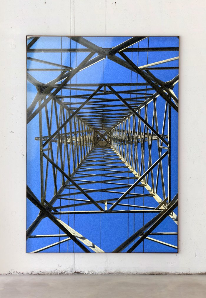 Mockup Studio result, framed photograph of an electricity pylon mounted on a gallery wall