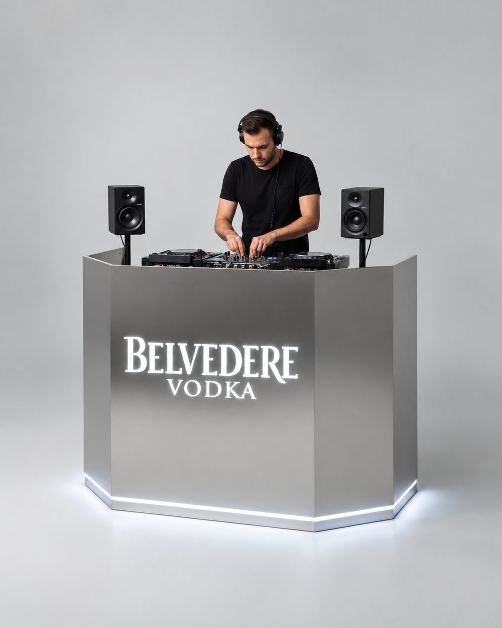 Open project: Belvedere Vodka at Elephant Labs, render of an octagonal brushed-stainless DJ booth with a backlit Belvedere logo and a glowing LED base