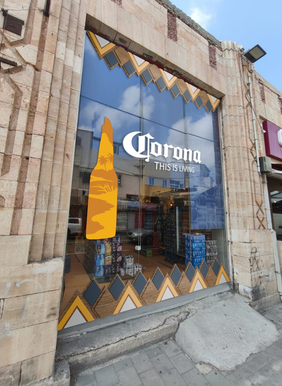 Corona window treatment on a stone storefront: a large bottle silhouette, the Corona logo and a geometric sun-pattern frame