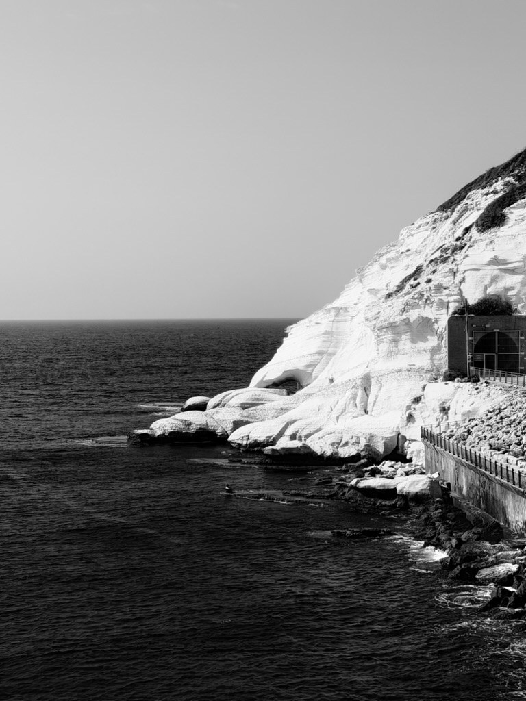 Open series: Rosh HaNikra — the white chalk cliffs meeting a dark sea, black and white